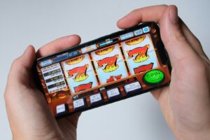 Someone is playing a mobile slot machine game.